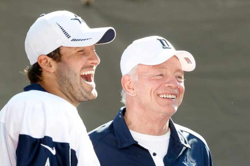 Dallas Cowboys quarterback Tony Romo (9) and owner Jerry Jones laugh after their afternoon...