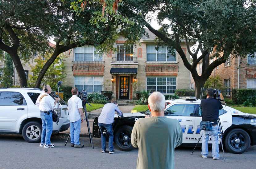 Media and bystanders look at the residence at 5700 block of  Marquita, where reportedly a...