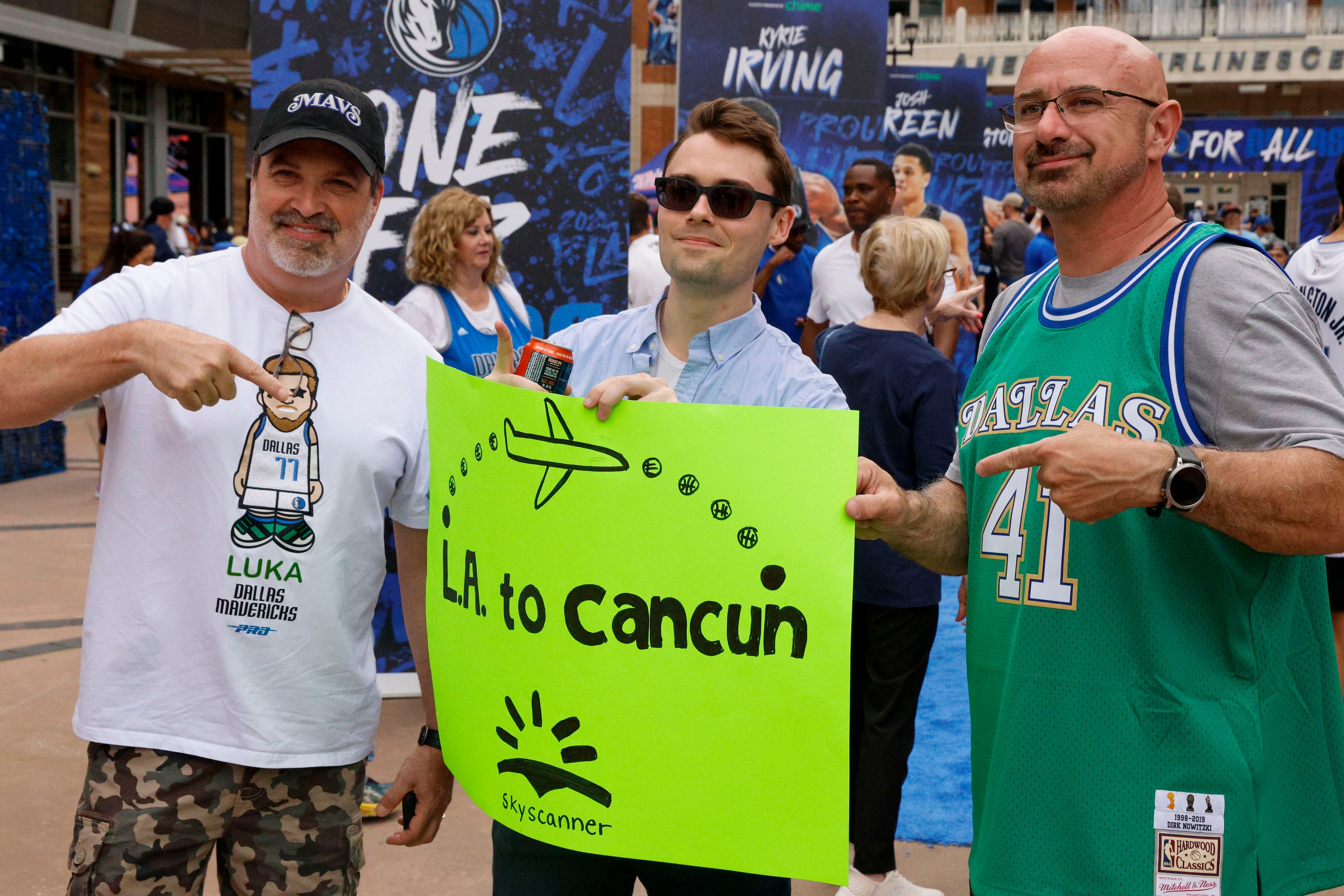 Eddie Brooke (left) and George Deares (right) point to a sign made by Griffin Miller before...