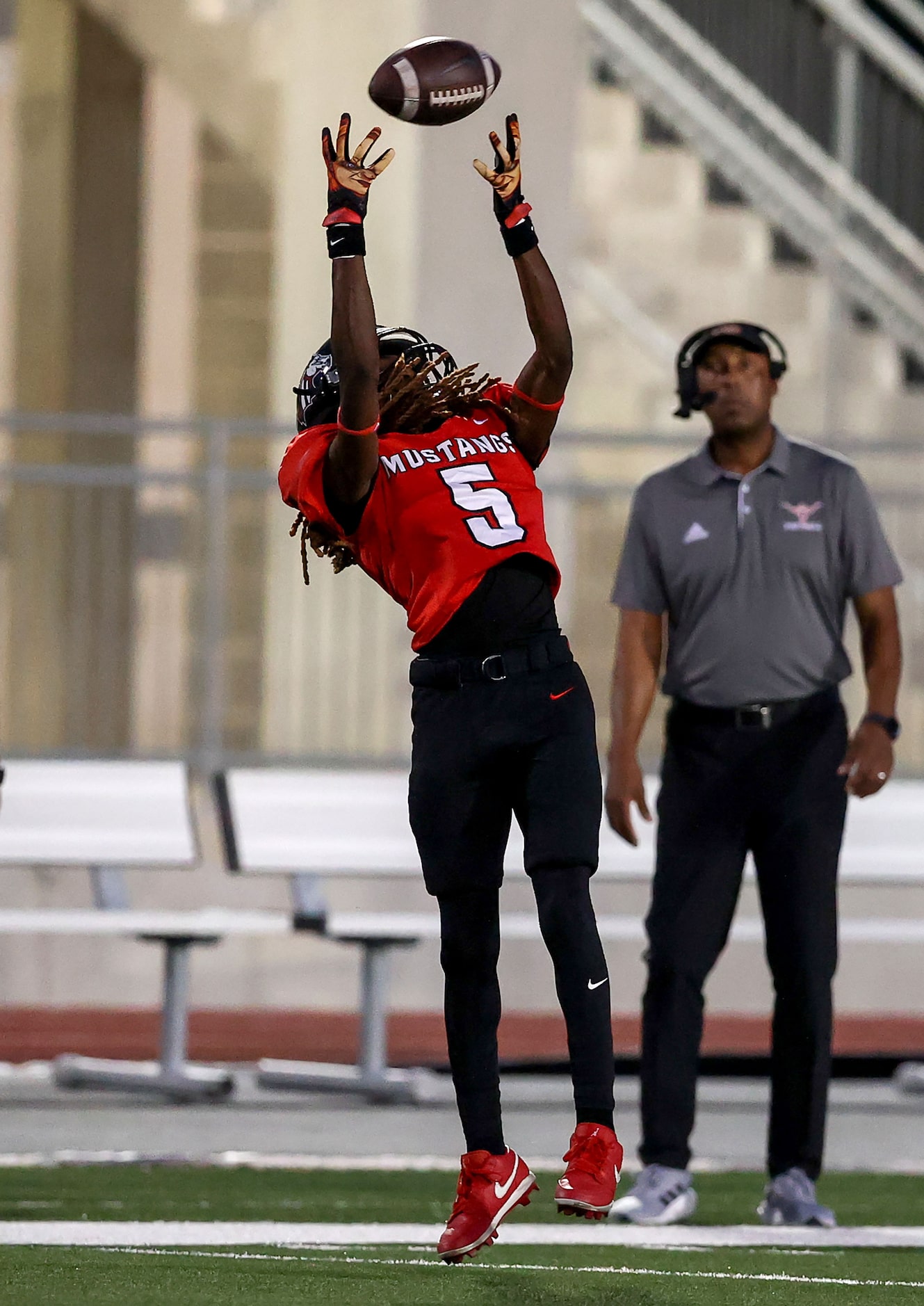 Creekview wide receiver Christopher Blackmon goes up high to pull down a reception against...