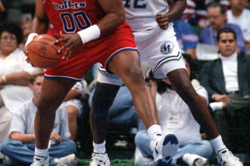 ORG XMIT:  October 22, 1994 - Dallas Mavericks' Roy Tarpley (42) defends Washington ...