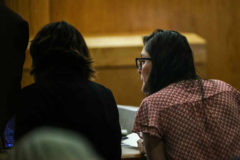 Brenda Delgado (right) speaks to an attorney during her murder trial in the 363rd Judicial...