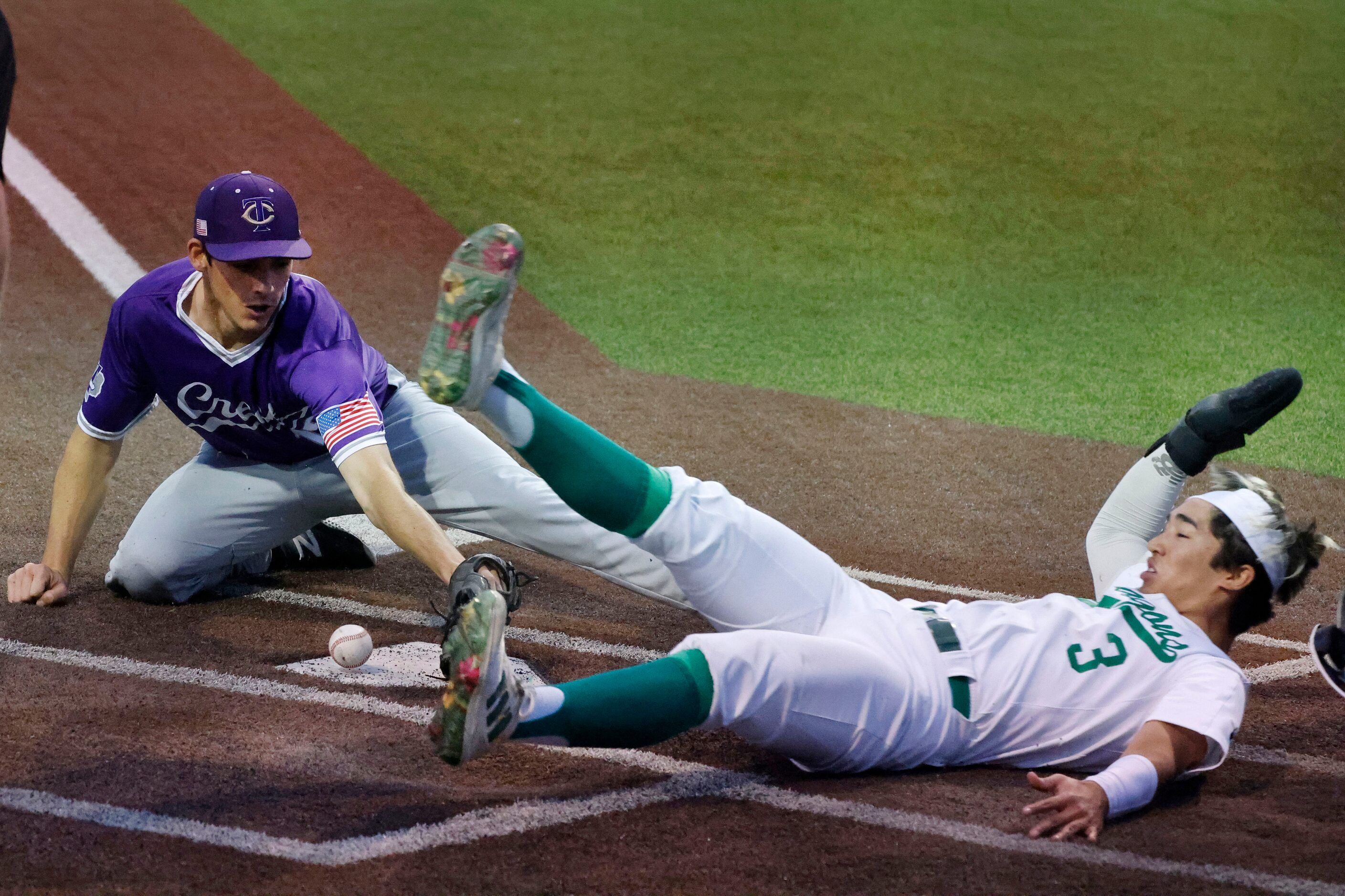 Southlake Carroll’s Max Reyes (3) scores as Keller Timber Creek pitcher Jonah Hartnett,...