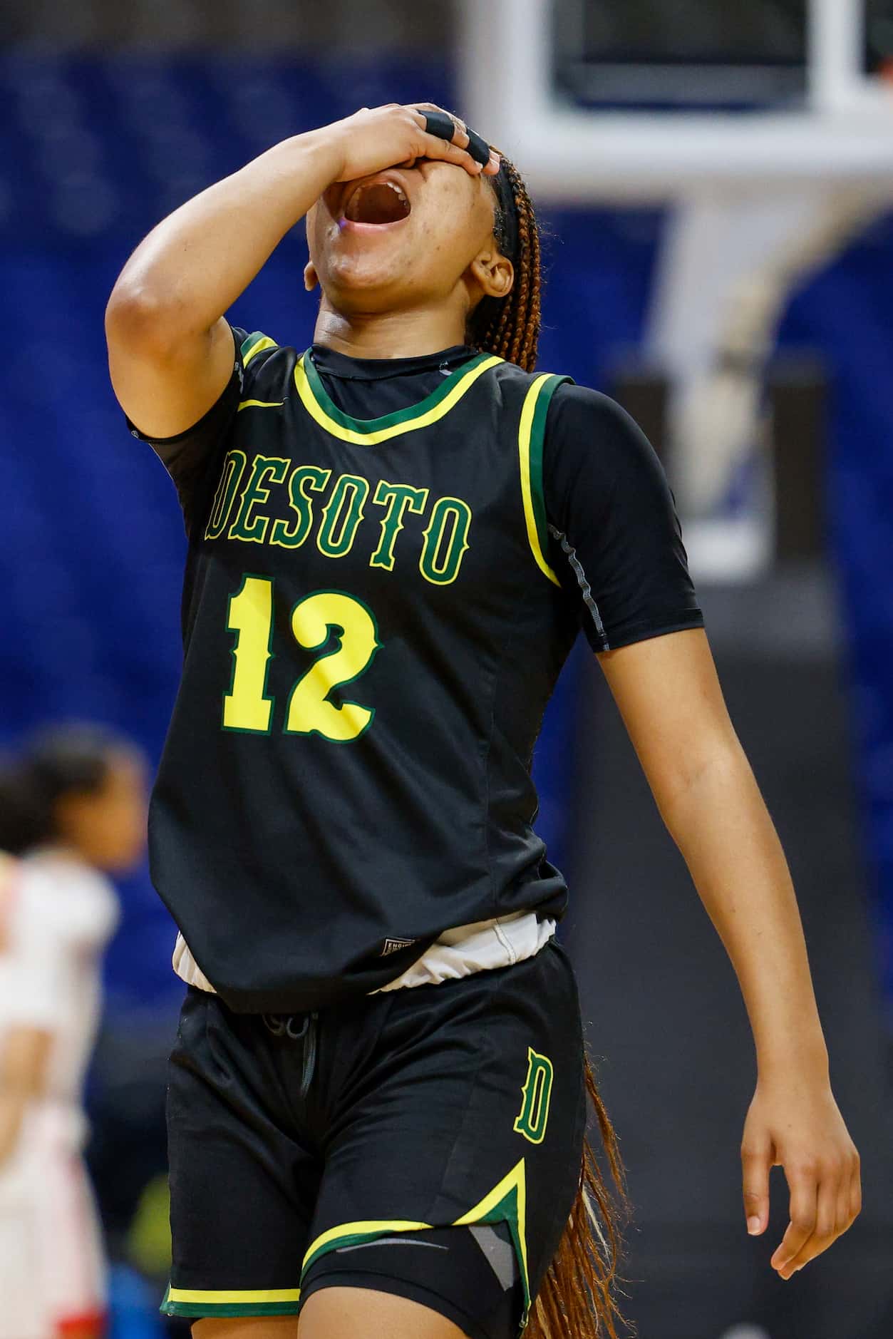 DeSoto guard Jiya Perry (12) reacts after having a foul called against her during the fourth...