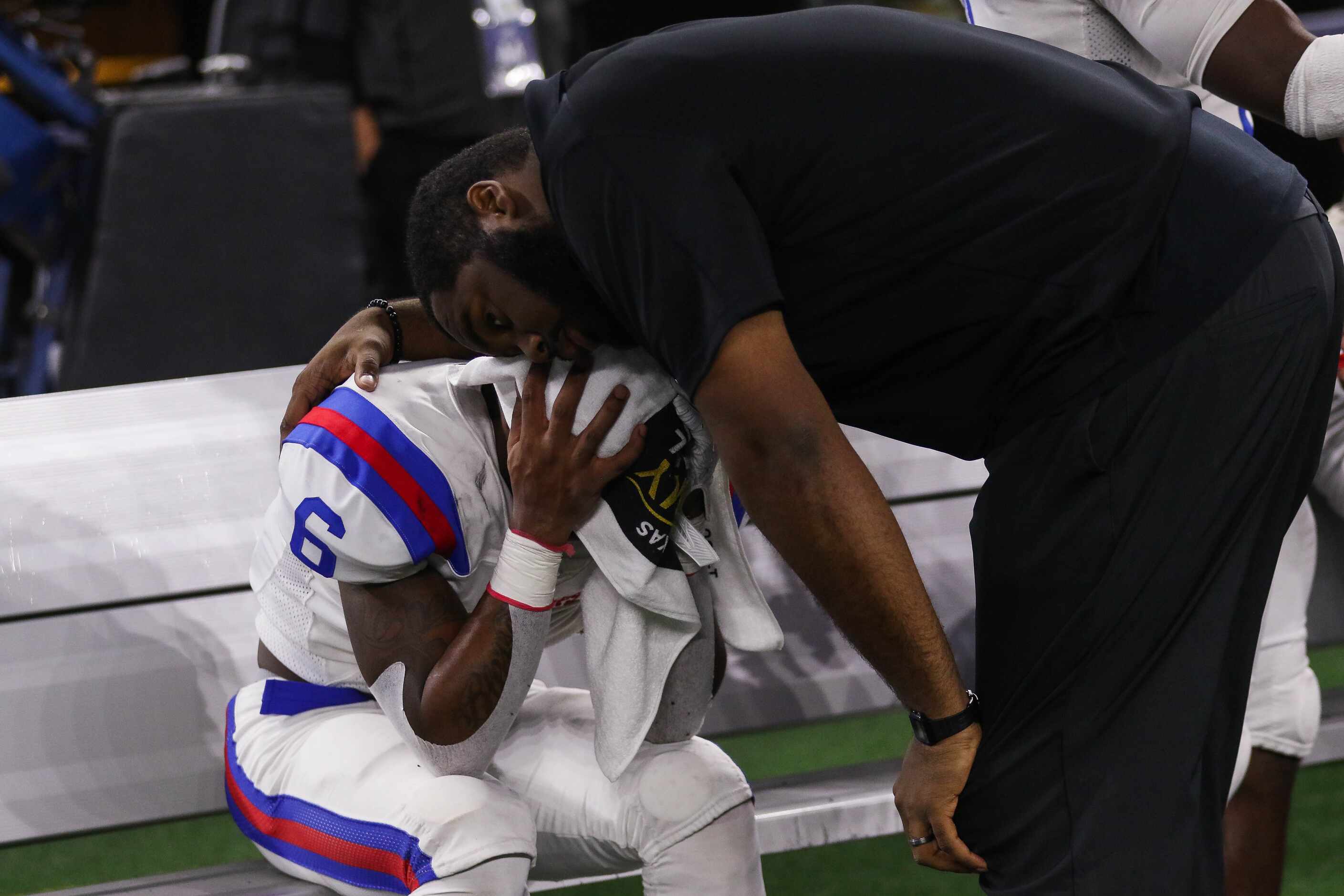 Duncanville's WR Marquelan Crowell (6) is consoled after losing a Class 6A Division I state...