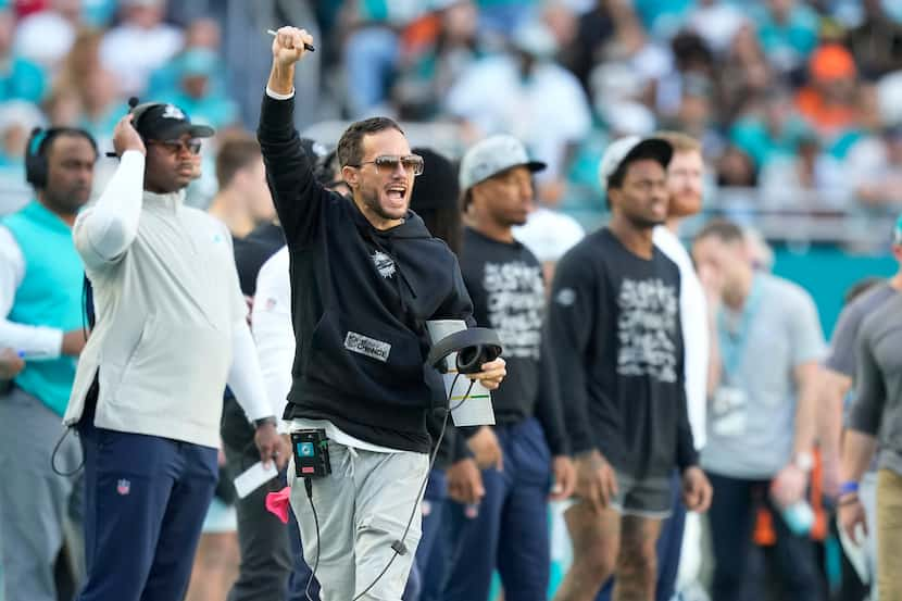 Miami Dolphins head coach Mike McDaniel gestures during the first half of an NFL football...