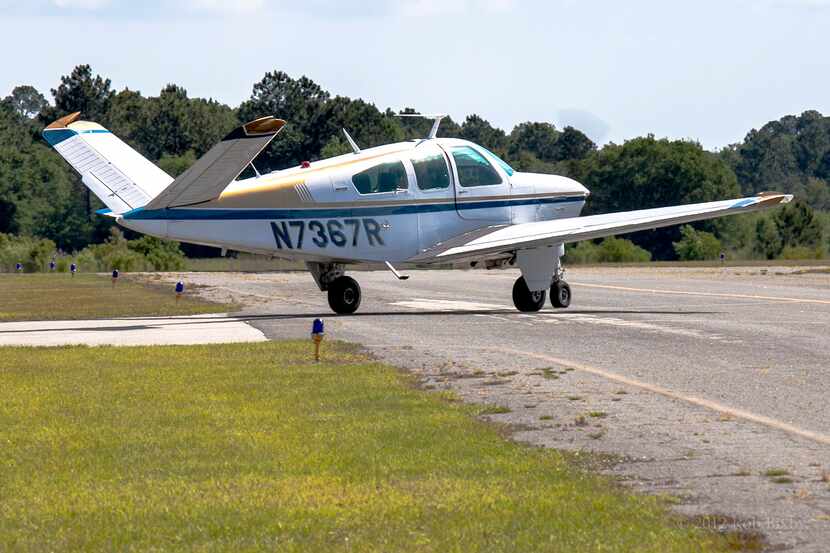 This is a photo of a Beechcraft V35B Bonanza single engine plane. The Beechcraft V35B...