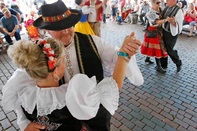 Couples in costume dance the polka in Ennis.