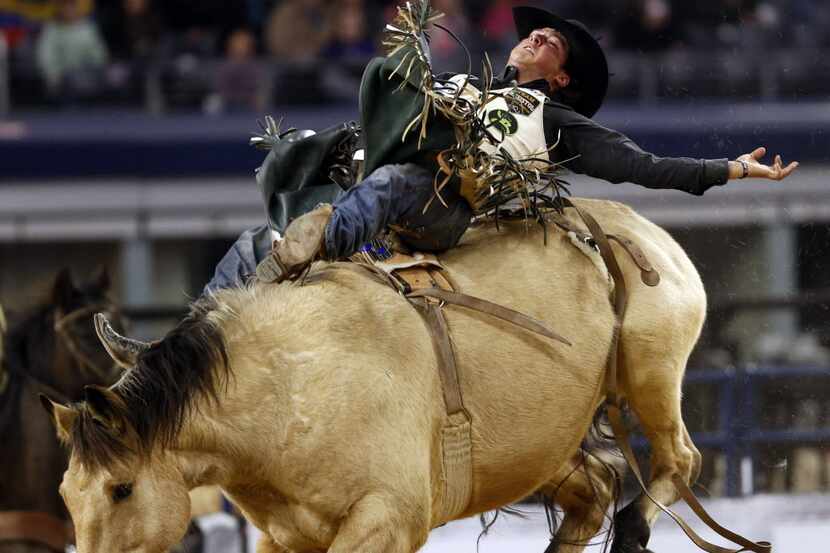 Richmond Champion of Dublin, Texas, competes in the bareback final 4 shoot-out event during...
