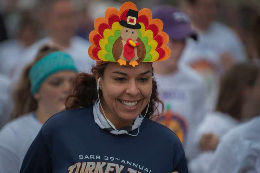 A runner wears her turkey cap during the annual Fort Worth YMCA Turkey Trot.