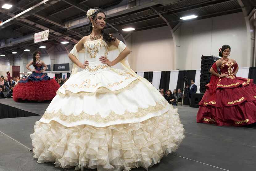 Quinceañera dresses are modeled during the Quince Girl Expo.