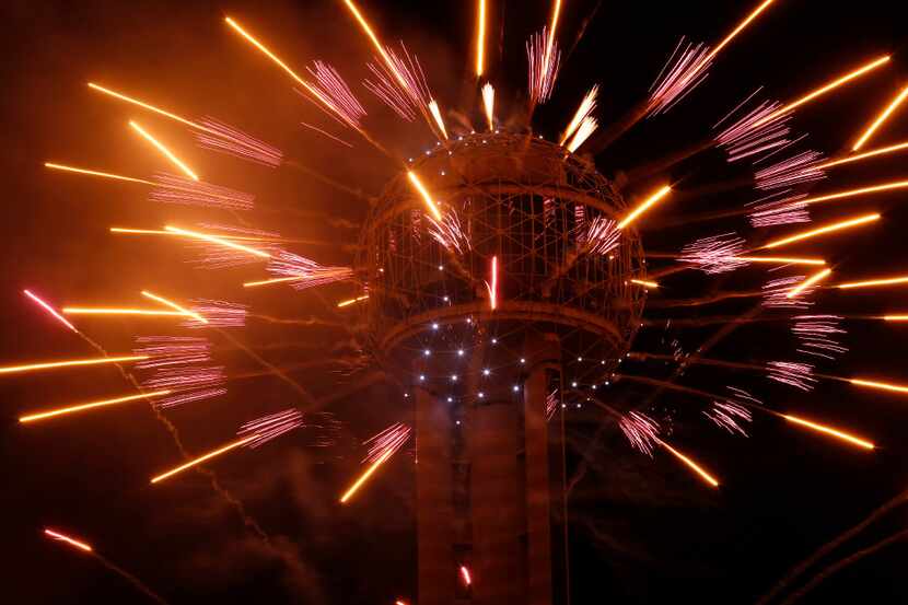 Fireworks fly from Reunion Tower on New Year's Eve in Dallas.