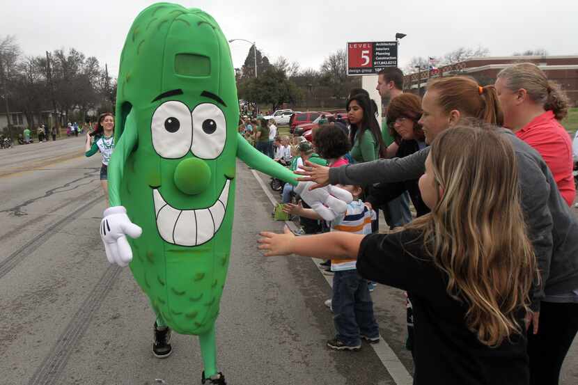 "Pickle Dude" greets people during an earlier St. Paddy's Pickle Parade and Palooza.
