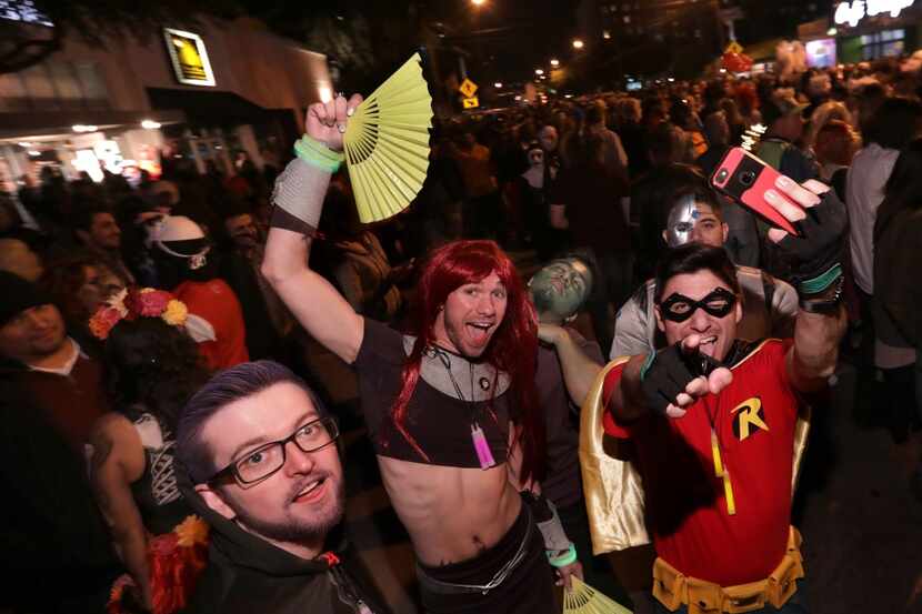 Partygoers enjoy the festivities during the Oak Lawn Halloween Block Party.