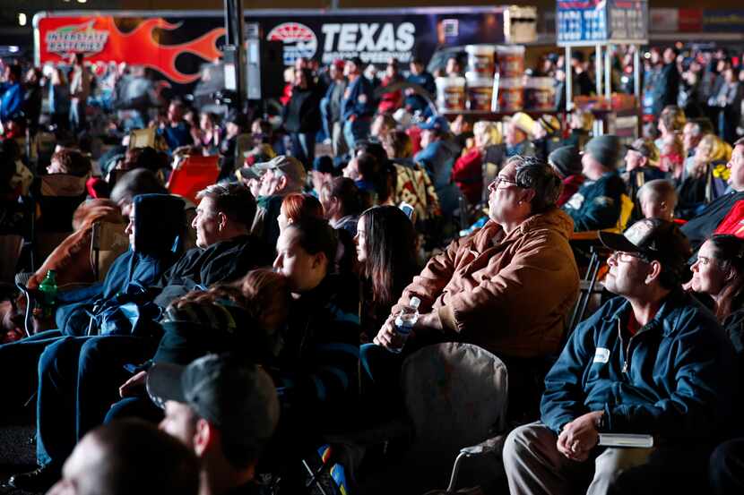 Race fans watch Texas Motor Speedway's "Big Hoss" TV. The 94ft x 218ft screen on the...