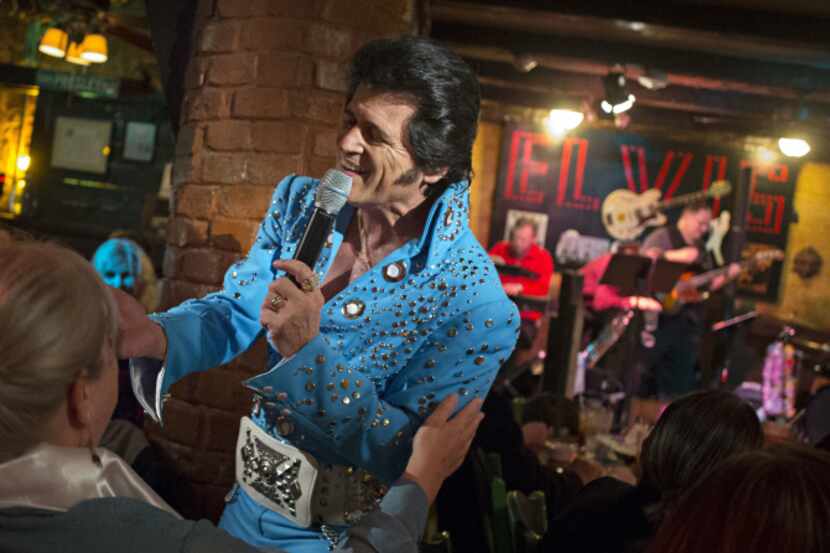 Performing as Elvis Presley, tribute artist Johnny Rockit sings at El Ranchito restaurant in...