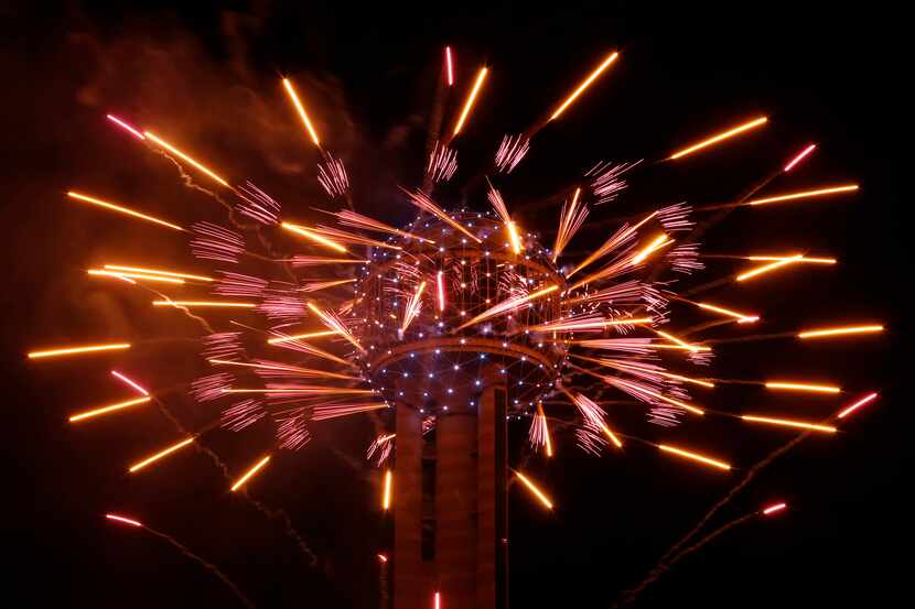 Fireworks fly from Reunion Tower.