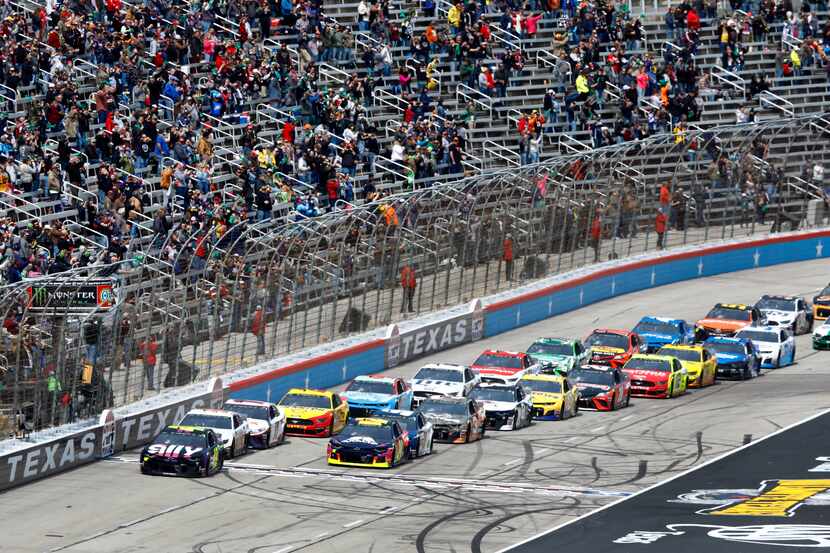 Race cars are on the track at Texas Motor Speedway in Fort Worth.