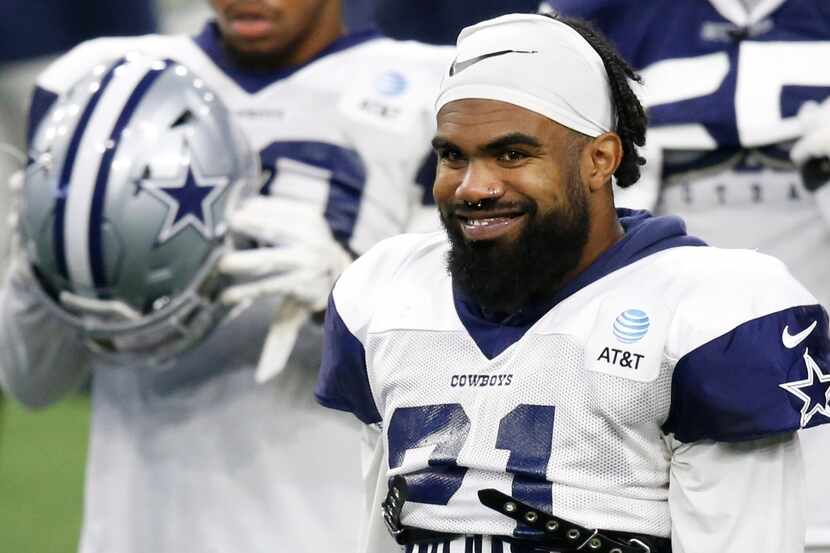 Dallas Cowboys running back Ezekiel Elliott smiles during training camp in 2020.  