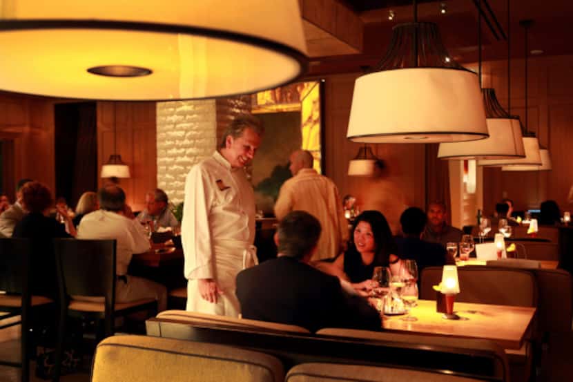 Chef Dean Fearing talks to patrons Selena Lacroix of Dallas and Nicola Gavazzi of Milan in...