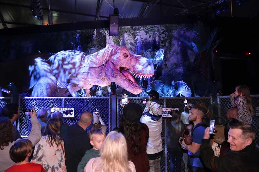 Guests enjoy the dinosaur themed activities at Jurassic World: The Exhibition at Grandscape...