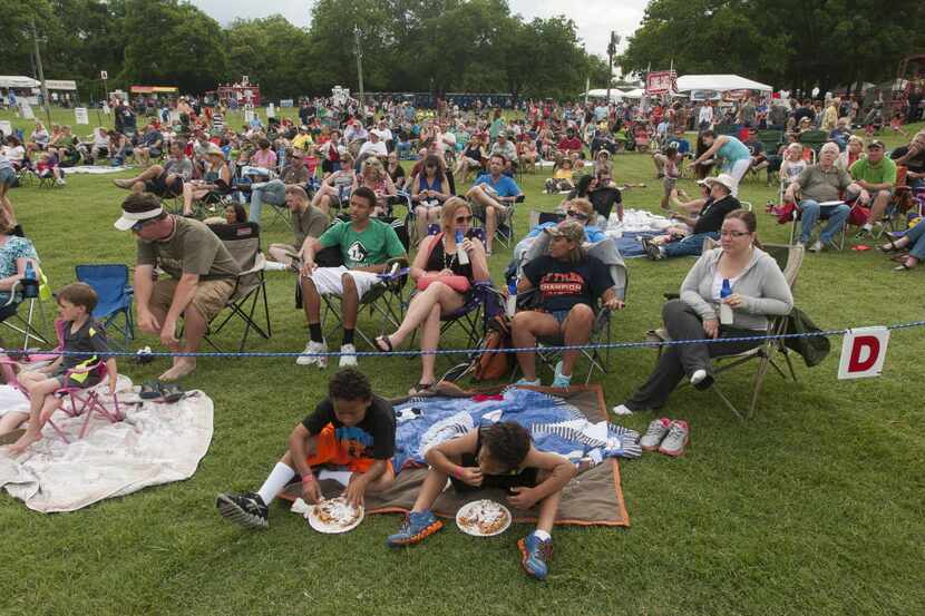 Concert goers spread out on the lawn of Farmers Branch Historical Park.