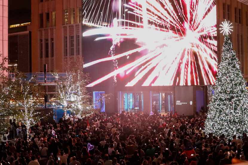 Fireworks are seen on the Media Wall in downtown Dallas at the AT&T Discovery District.