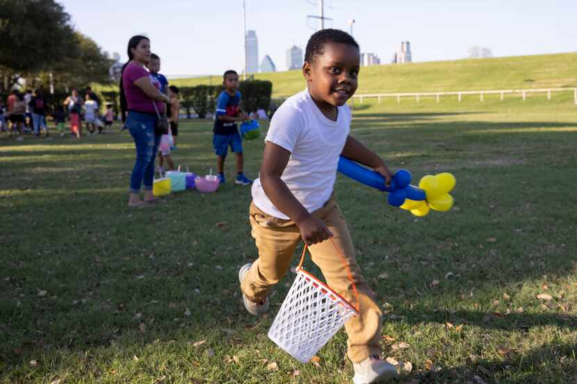 Peter King, 4, runs around before a Dallas Park and Recreation Egg'stravaganza Easter egg hunt.