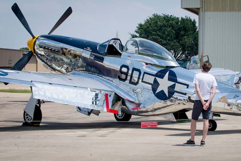 A visitor to the Warbirds Over Addison event at the Cavanaugh Flight Museum checks out the...