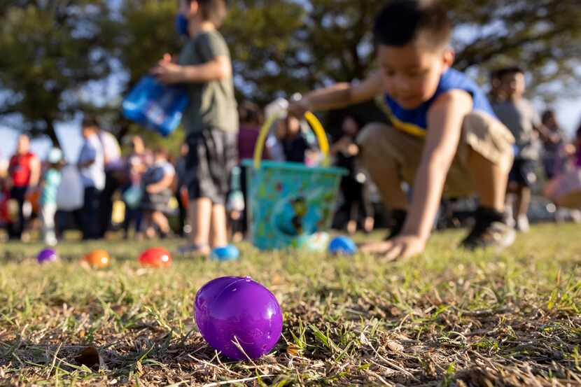 Kids look for eggs during a Dallas Park and Recreation Easter event.