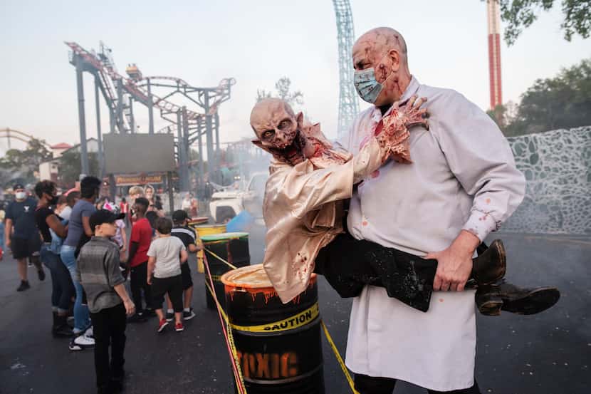 The Lab Doctor and Victor scare families at the Toxic Danger display at Six Flags Hallowfest.