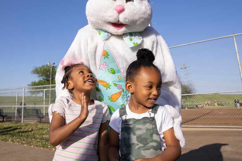 Piper Deadmon, 4, and Hollis Ward, 4, pose for a photo with the Easter bunny at Dallas Park...