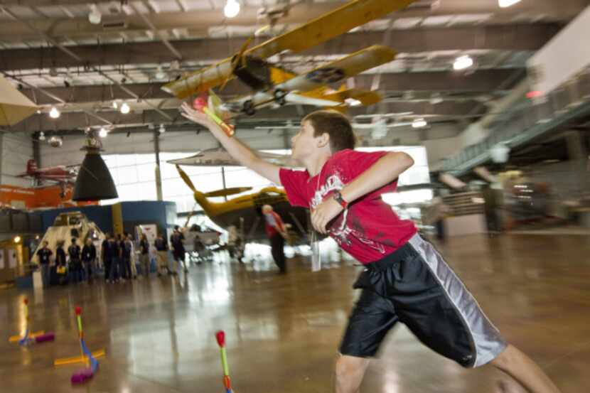 Zack Shawver catches an air rocket during a summer flight school at the Frontiers of Flight...