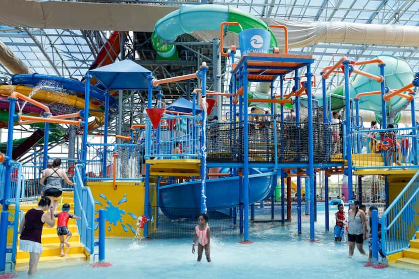 People play on a water playground at Epic Waters in Grand Prairie.