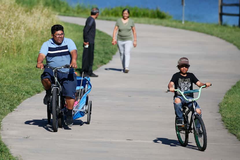 Park goers enjoy the nice weather at Oak Point Park and Nature Preserve in Plano.