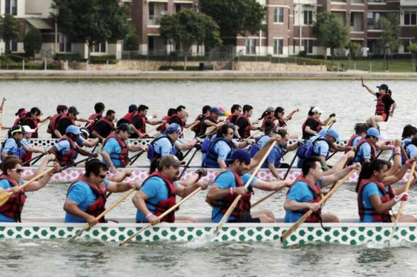 
Teams compete in the dragon boat races at the DFW Dragon Boat, Kite and Lantern Festival in...