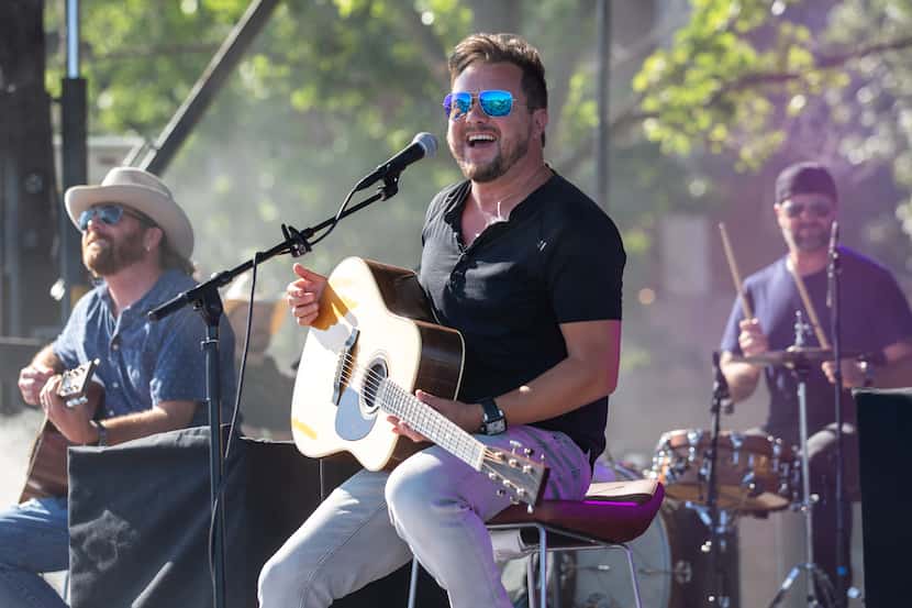 Eli Young Band performs for a crowd in their cars as they tune into an FM radio station for...