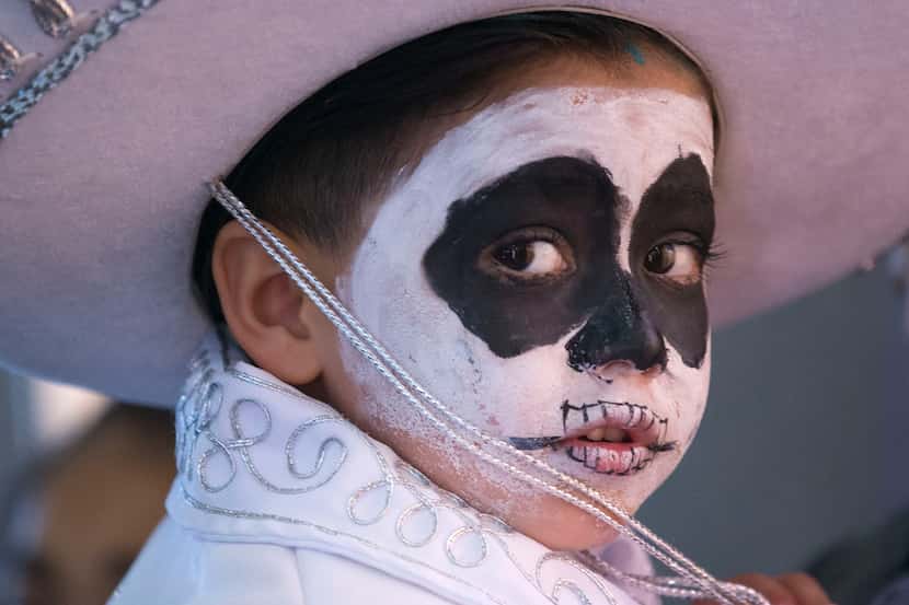 Xavi Villarreal of Oak Cliff wears paint on his face during a Día de los Muertos celebration...