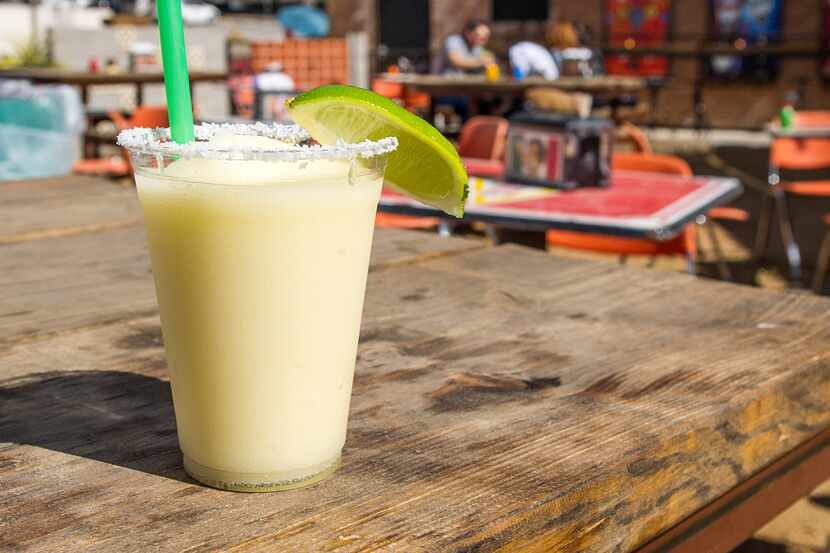 A frozen margarita sits on an outside table at Taqueria la Ventana.