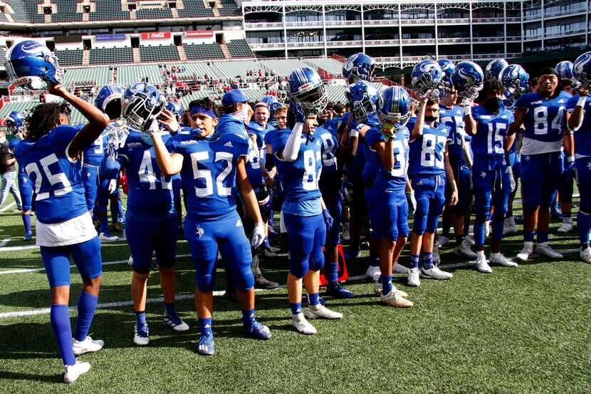 Fort Worth Nolan football players assemble for a November 2020 playoff game at Globe Life...