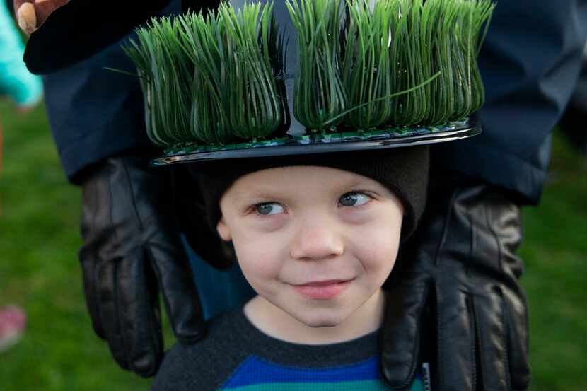 Jacob Scherer, 3, wears a top hat his grandmother took two days to make during the Dallas...
