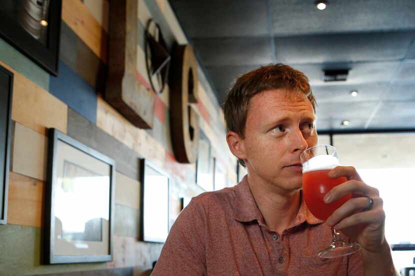 Jay Frank tries a beer at Lakewood Growler, photographed September 26, 2014.