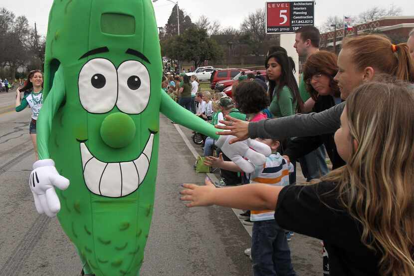"Pickle Dude" greets people during the Best Maid St. Paddy's Pickle Parade and Palooza on...