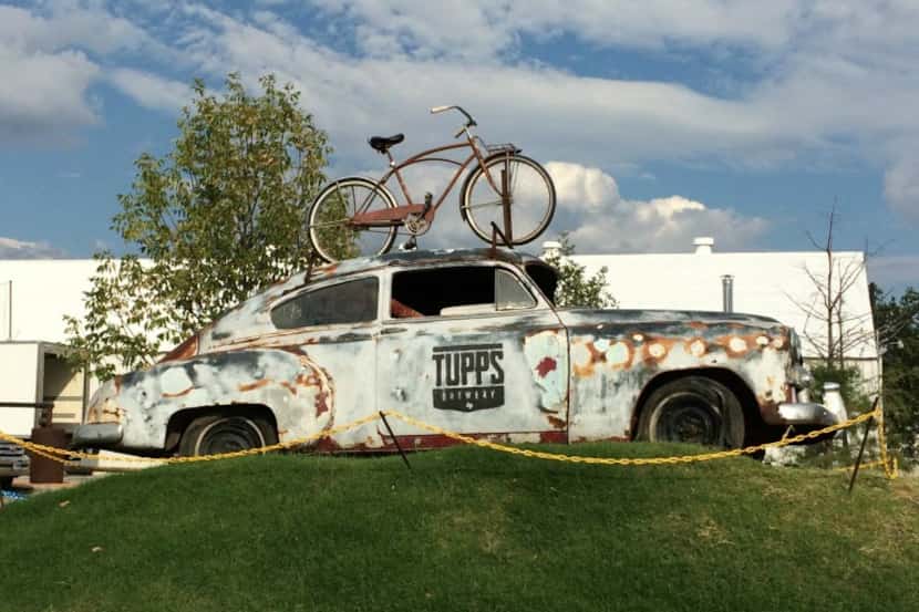 An old car sets the tone for funky Tupps Brewery, in McKinney's Cotton Mill area.