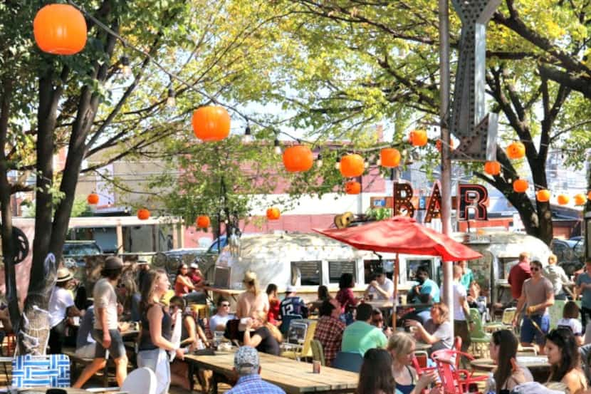 The beer garden at the Truck Yard offers plenty of mismatched lawn furniture to make you...