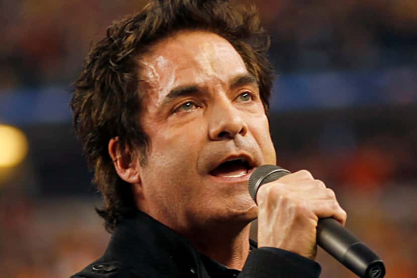 Patrick Monahan of Train sings the National Anthem before the Cotton Bowl game.