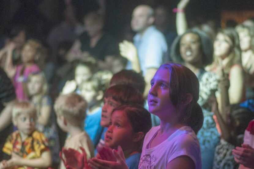 Children watch as KIDZ BOP Kids perform at the House of Blues.
