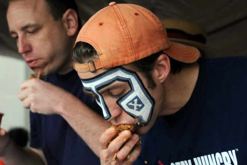 Professional eater Tim "Eater X" Janus competes in the World Tamale Eating Championship held...