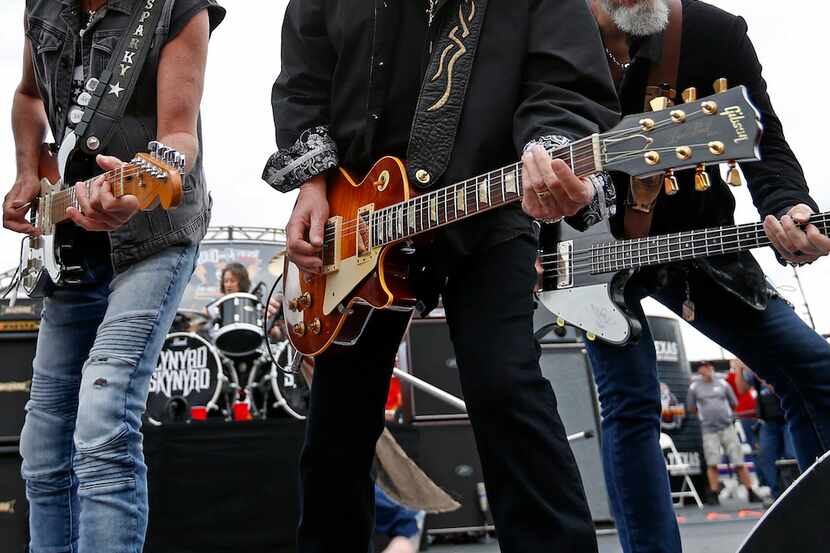 Members of Lynyrd Skynyrd perform onstage at Texas Motor Speedway.