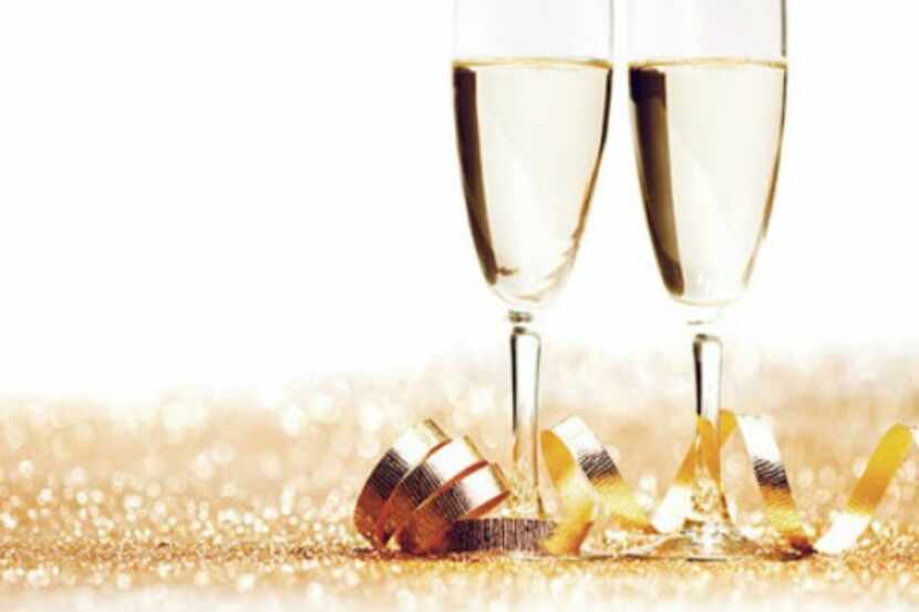 Glasses of champagne and decorative golden ribbon 